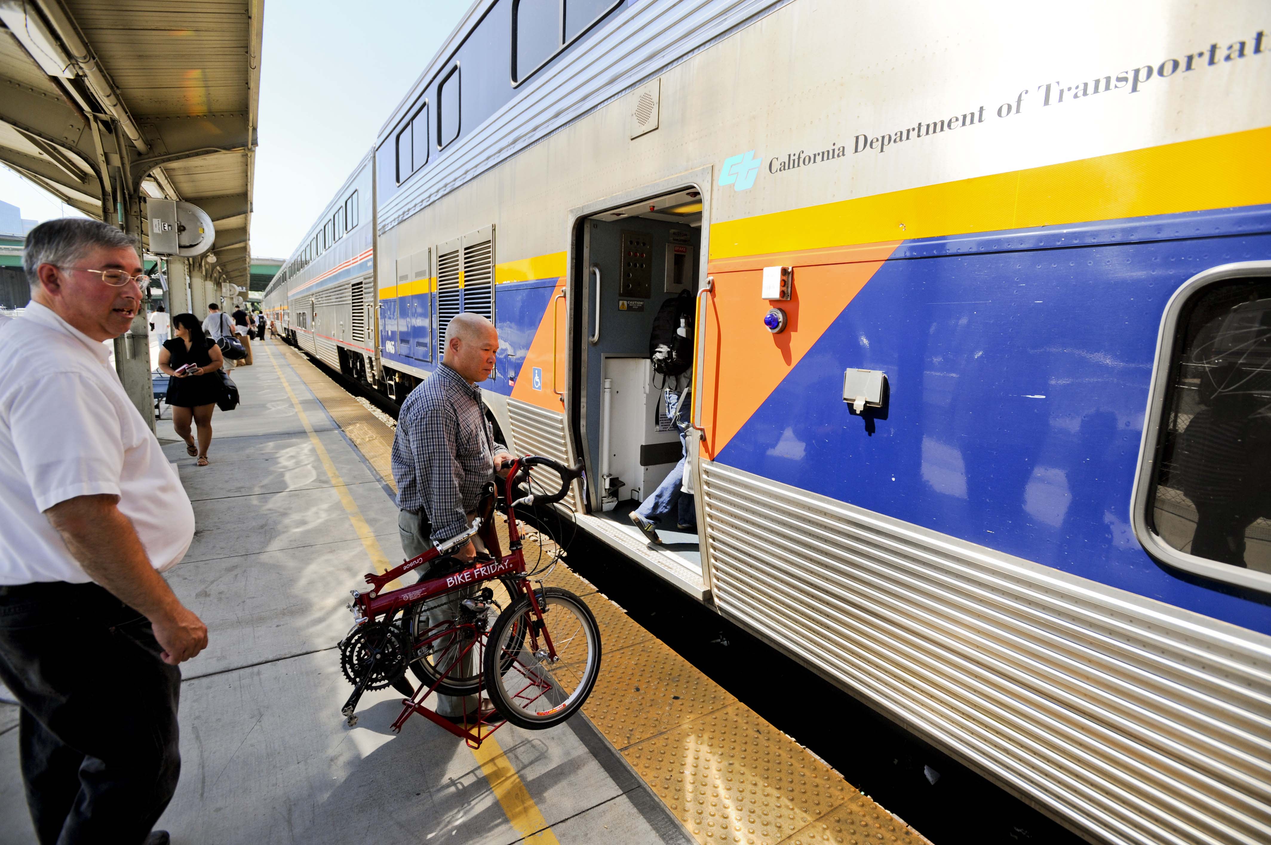 Cyclist boarding Amtrak train Sacramento