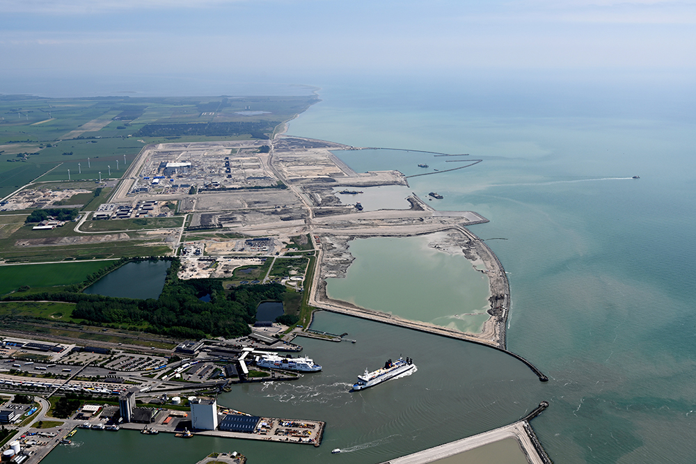 Work has started building the tunnel element factory (top of picture) near the ferry terminal at Rødbyhavn on the Danish island of Lolland © Femern