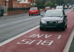 car driving in a bus lane