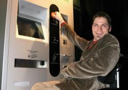 Wheelchair user using a ticket machine